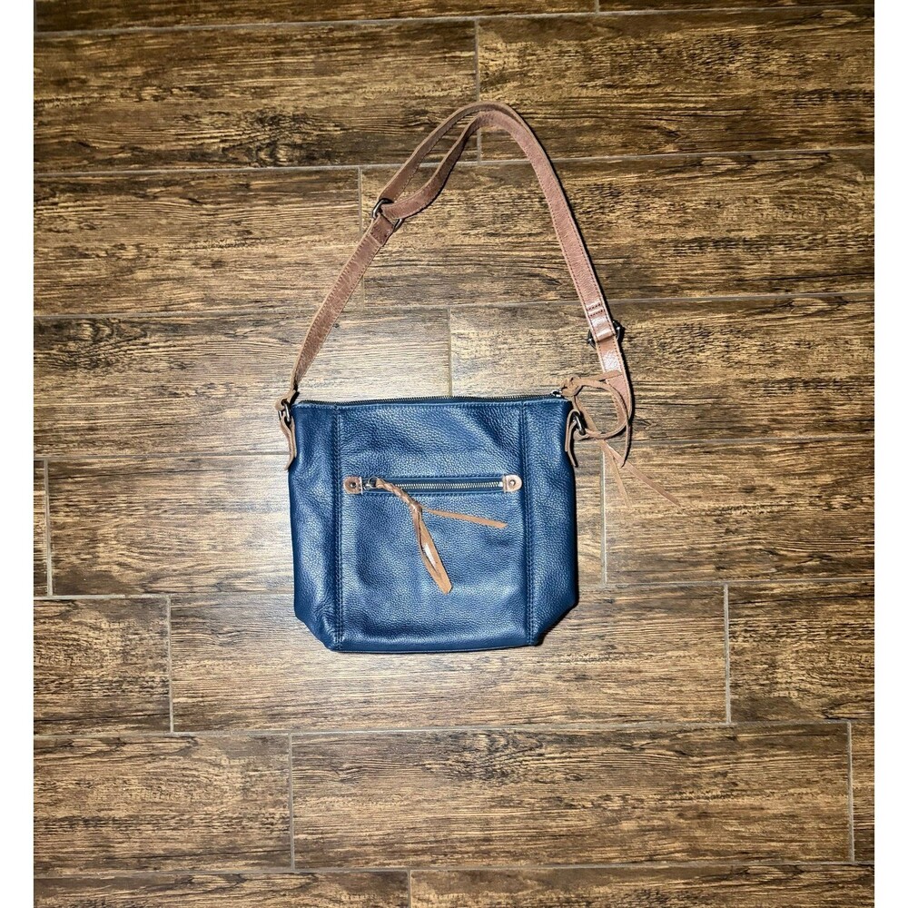 The Sak Navy Pebbled Leather Crossbody Bag with Adjustable Brown Strap